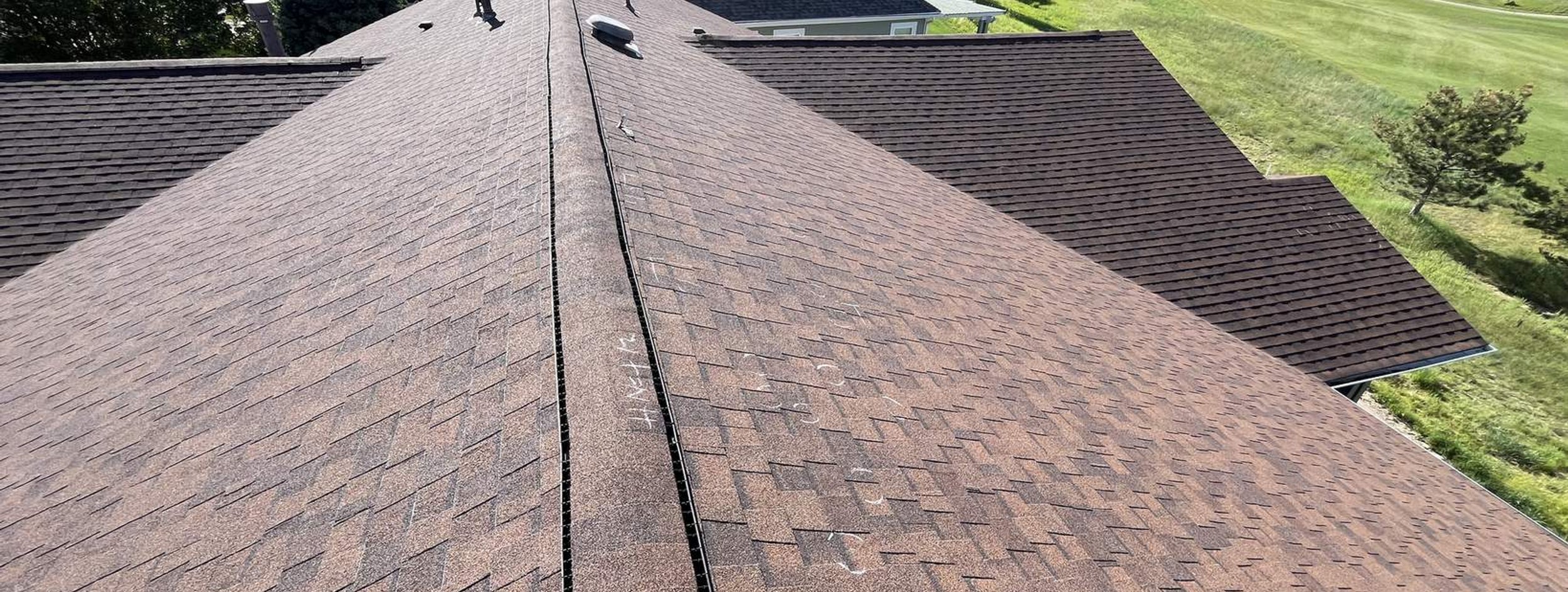 Hail-damaged four-year-old roof in Heritage Eagle Bend documented for an insurance claim