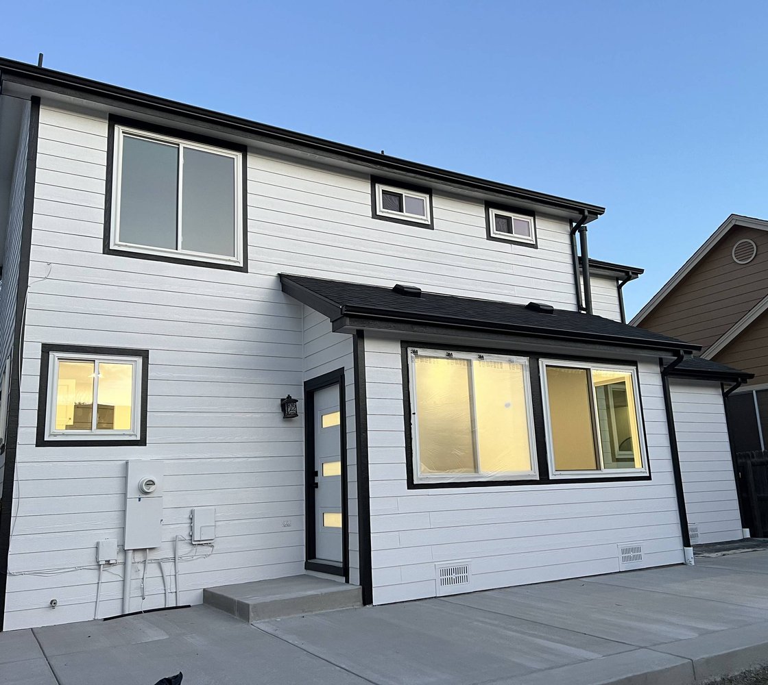 Front of a modern Douglas County home lined with energy-efficient windows