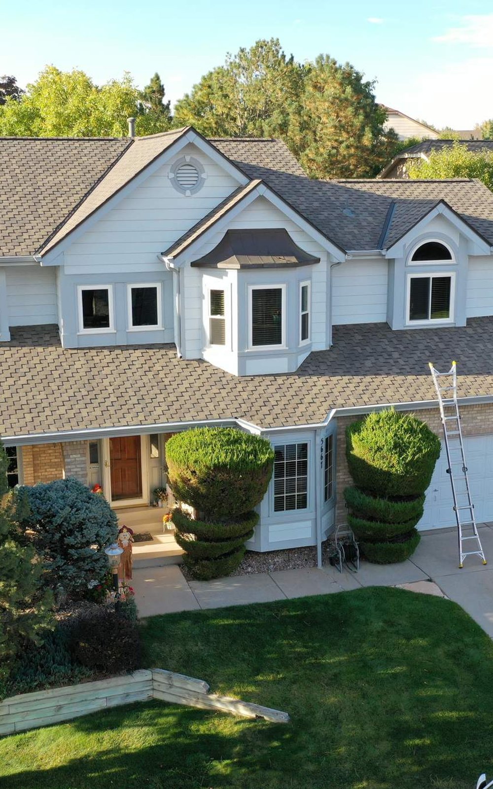Completed asphalt shingle roof replacement on a two-story home in Douglas County