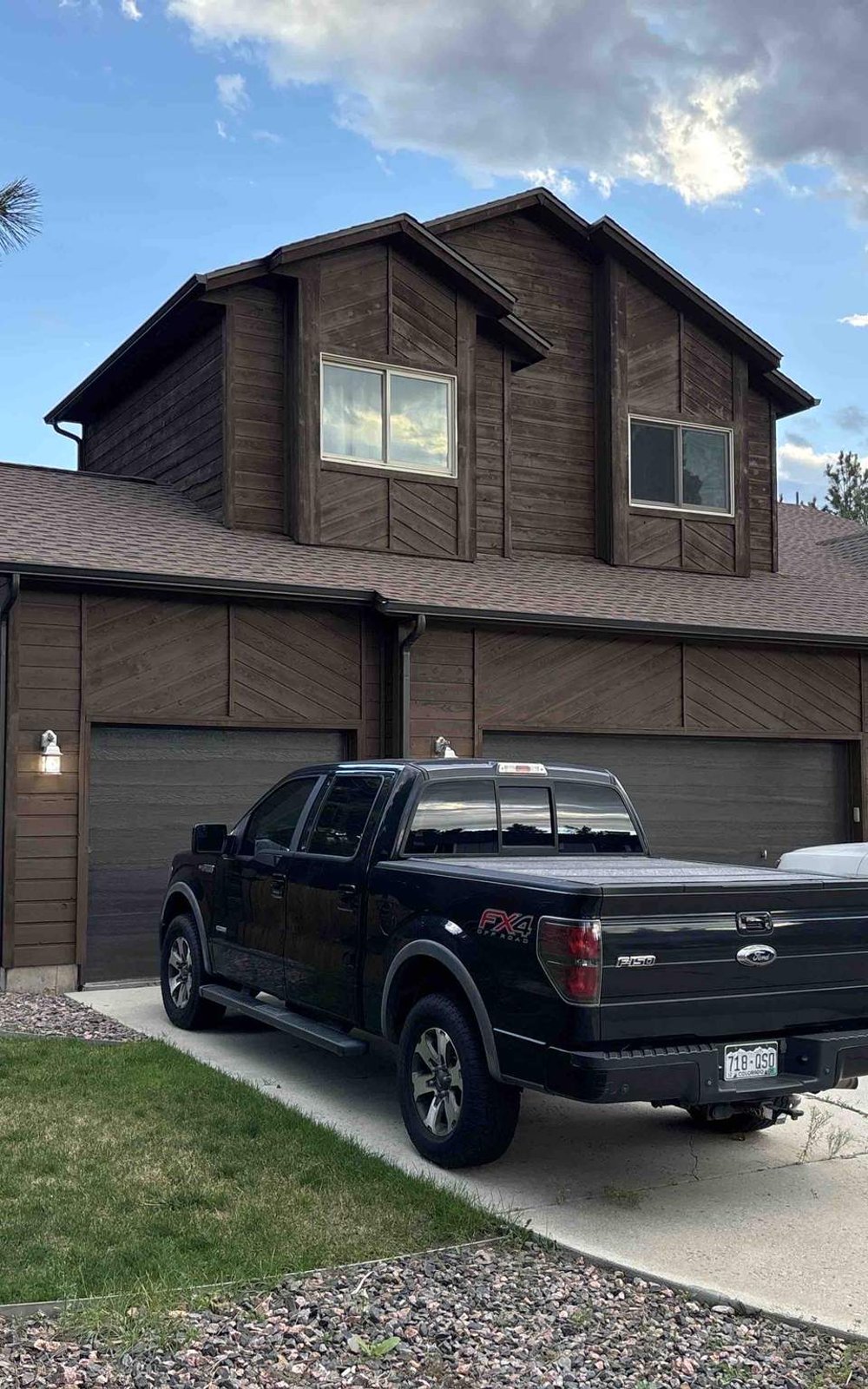 Completed cedar siding repair and repaint on a Douglas County home