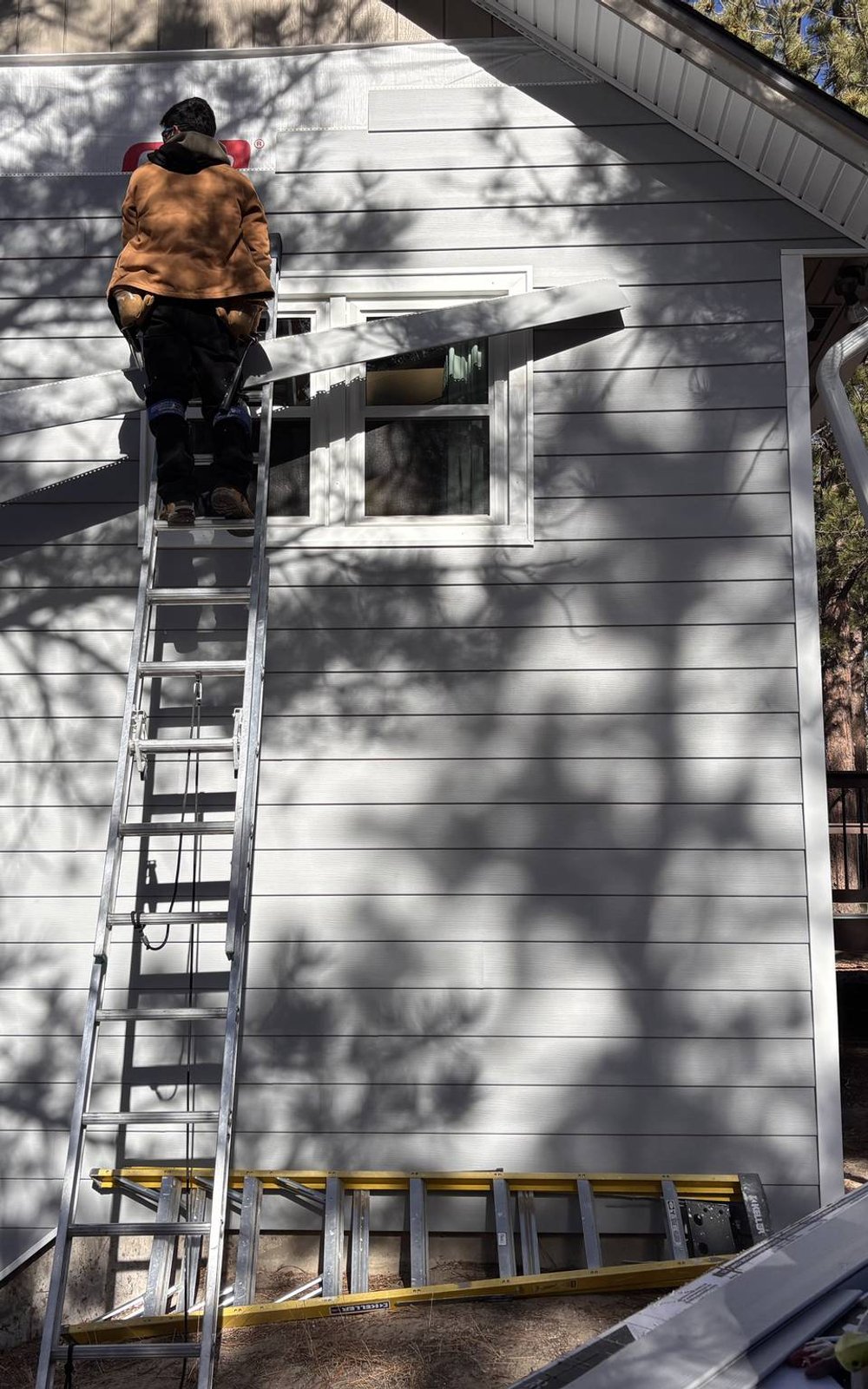 Align composite siding installed over house wrap and insulation