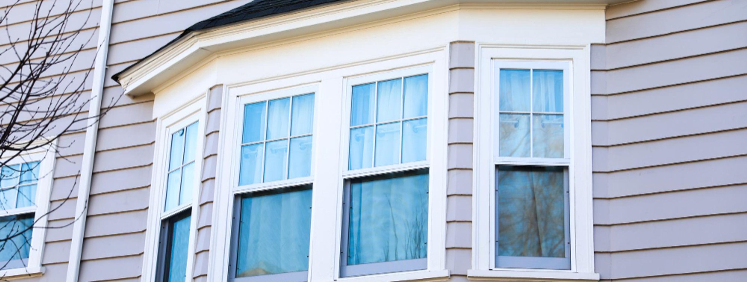 Home exterior with new vinyl windows in Parker Colorado